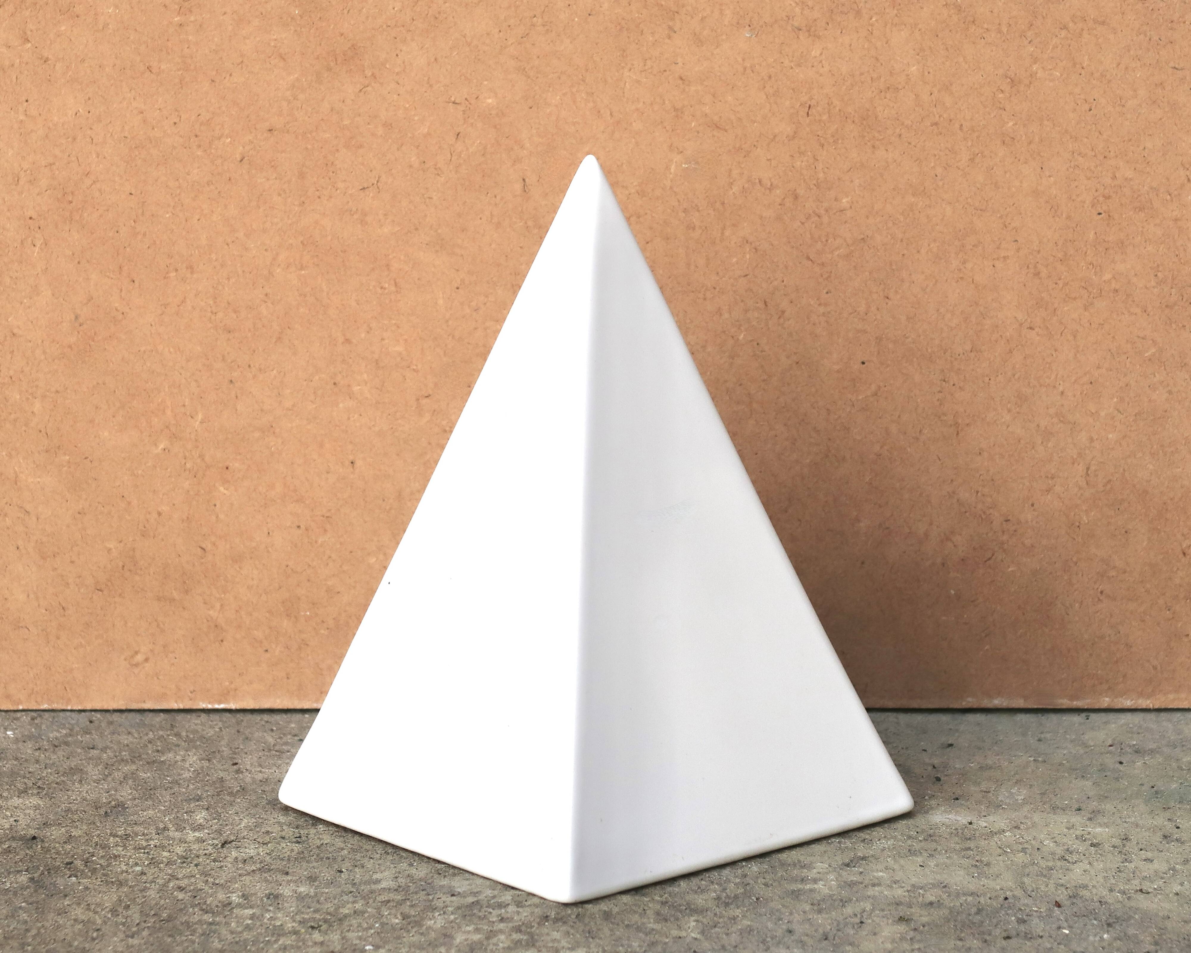 Minimalist white ceramic pyramid sculpture, 1970s.