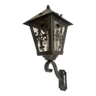 Old wall light - wrought iron lantern and opaque windows