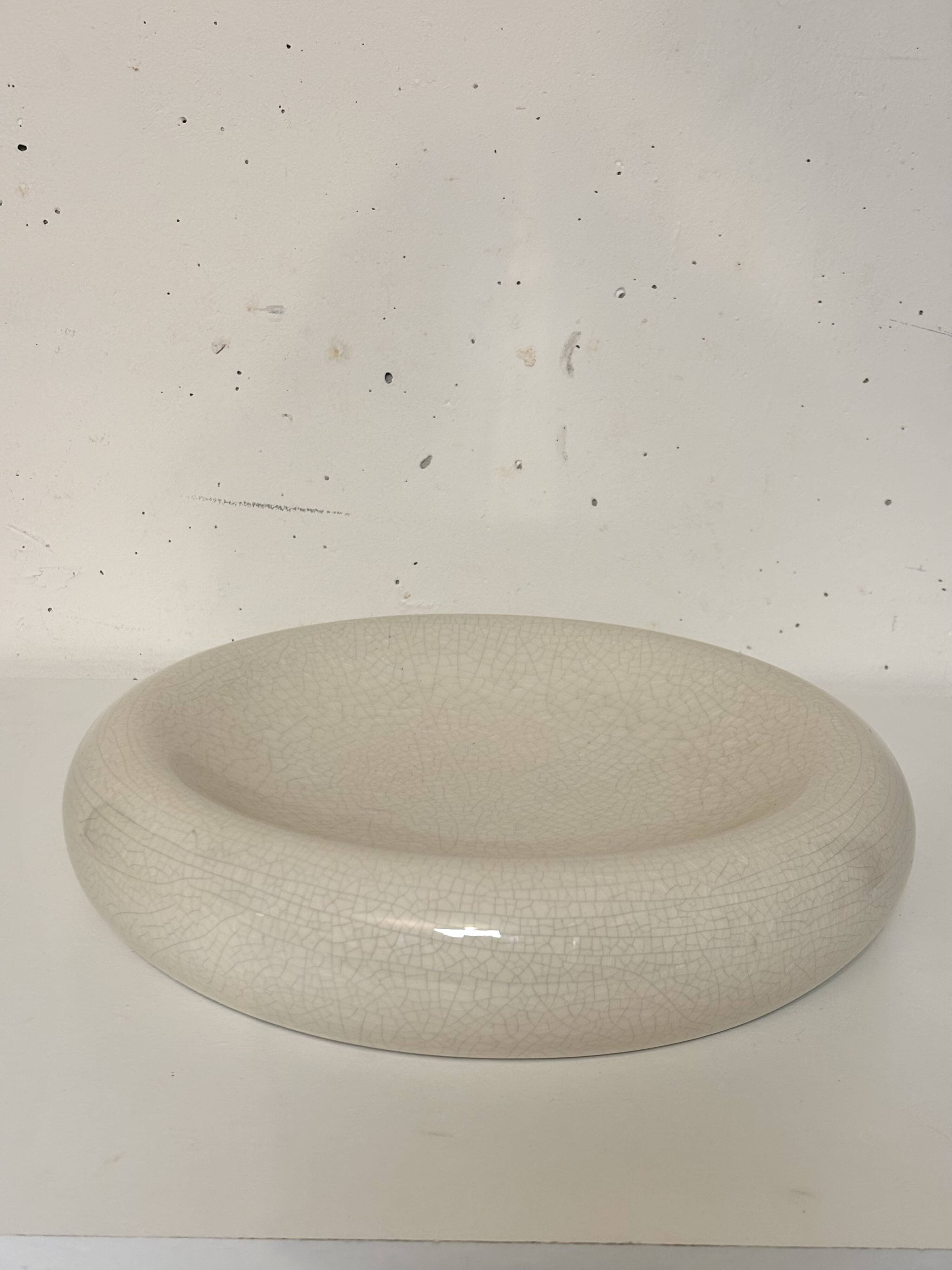 Empty pocket, cracked ceramic dish 1980