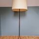 Vintage tripod floor lamp in black lacquered metal and brass, 50s