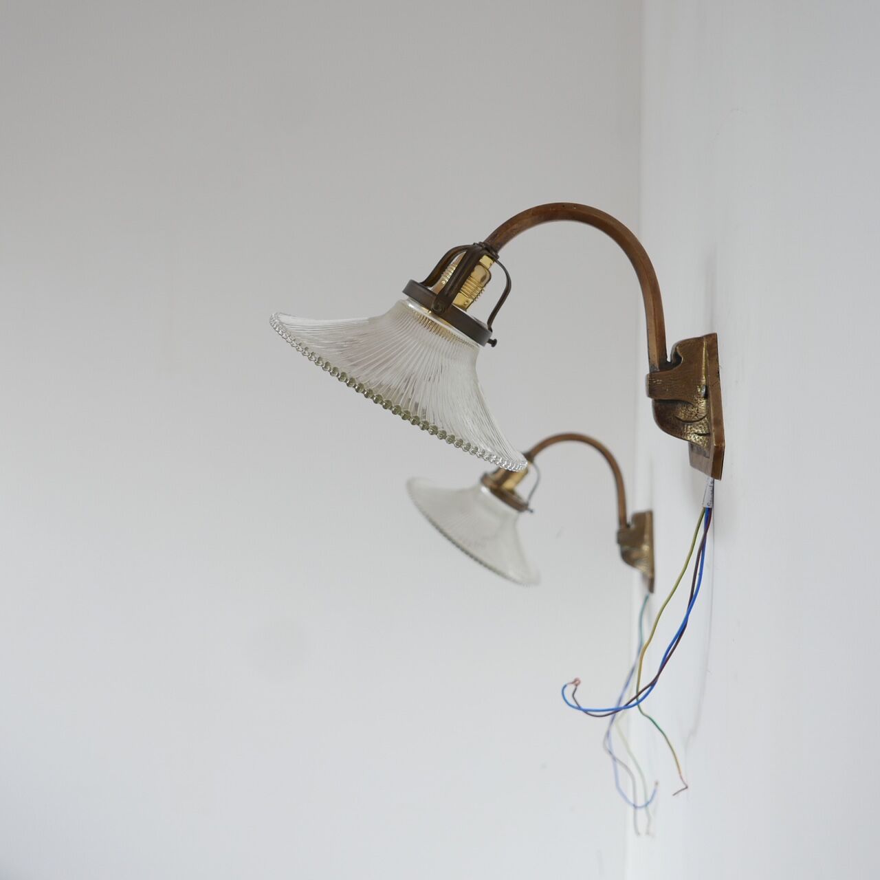 Pair of brass and glass wall sconces