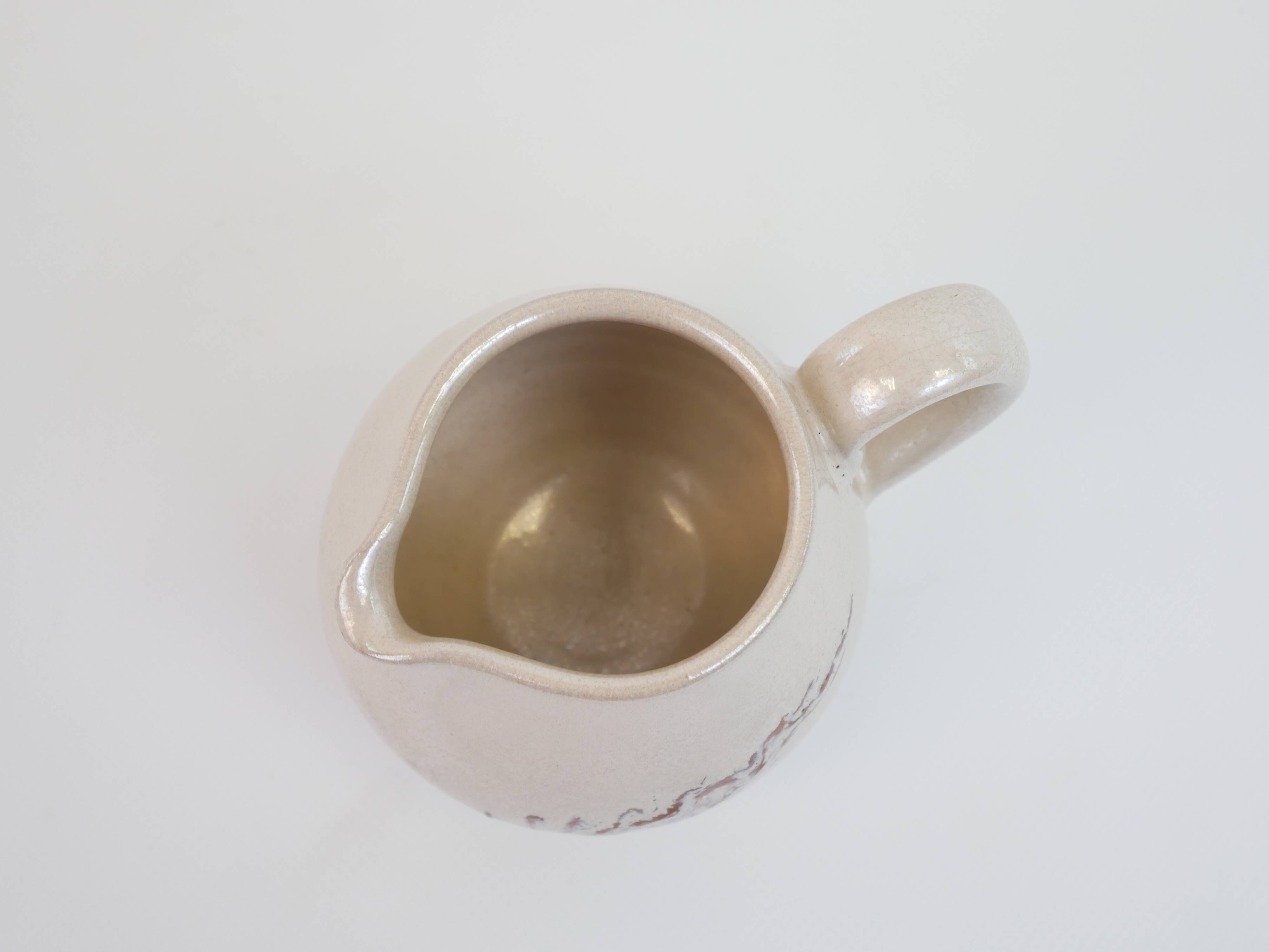 Pair of ceramic milk jugs signed La Roue Vallauris