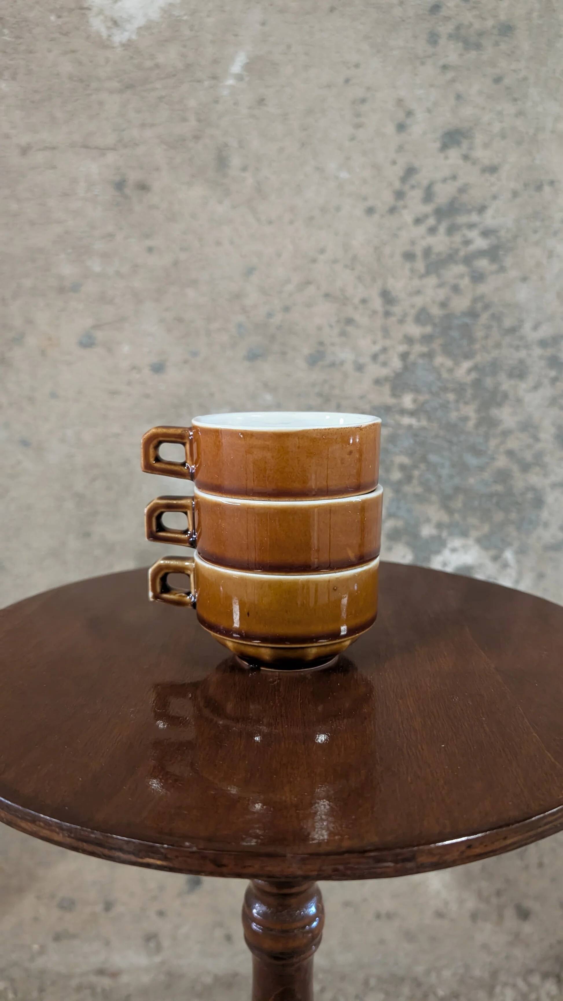 Trio of brown stoneware cups