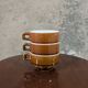 Trio of brown stoneware cups