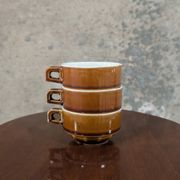 Trio of brown stoneware cups