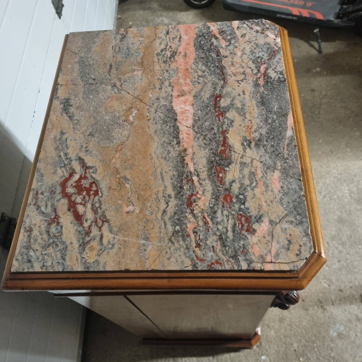 Cherry nightstand with pink marble.