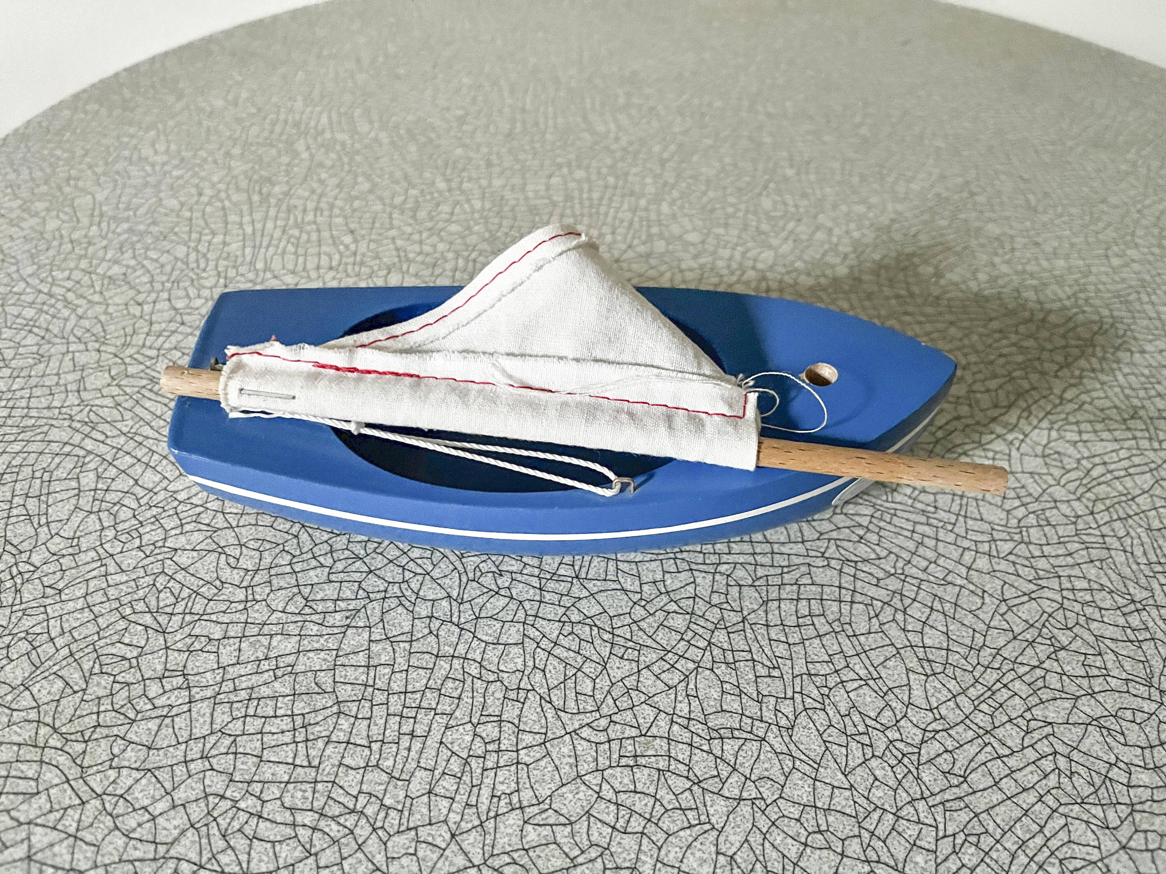 Blue basin sailboat from the French brand Tirot 200, vintage toy.