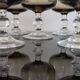 9 white wine glasses on vintage Luminarc smoked black stem