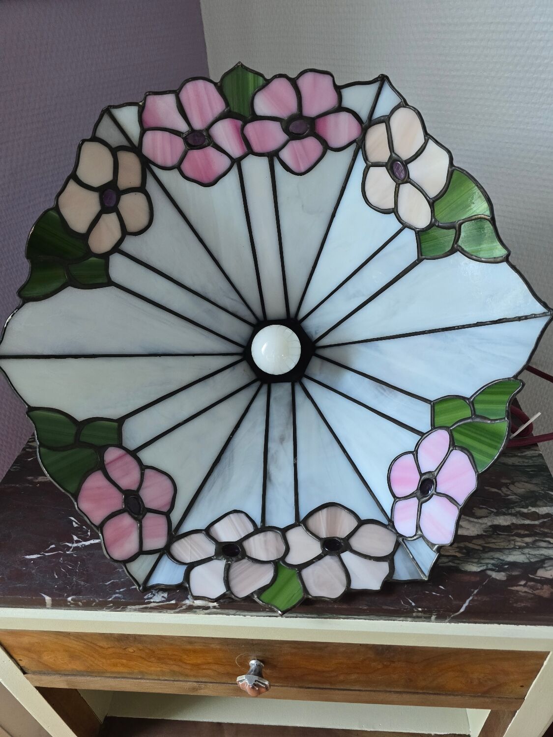 Tiffany-style stained glass lampshade with floral motifs.