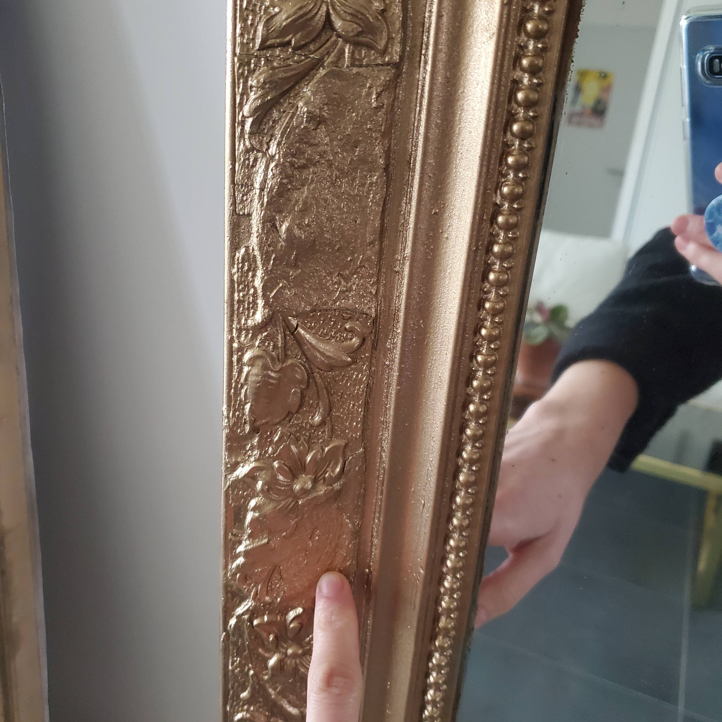 Antique mirror with gilded wood crests