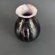 Antique black pitcher with white collar