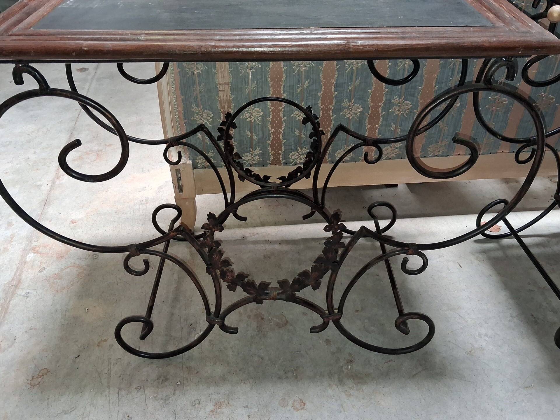 Pair of wrought iron and blackened wood consoles from the mid-20th century.