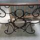 Pair of wrought iron and blackened wood consoles from the mid-20th century.