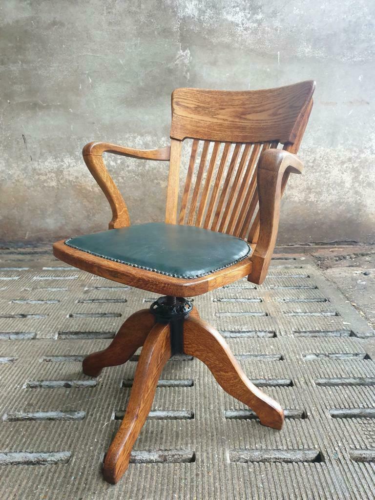 Antique office chair oak adjustable with green leather
