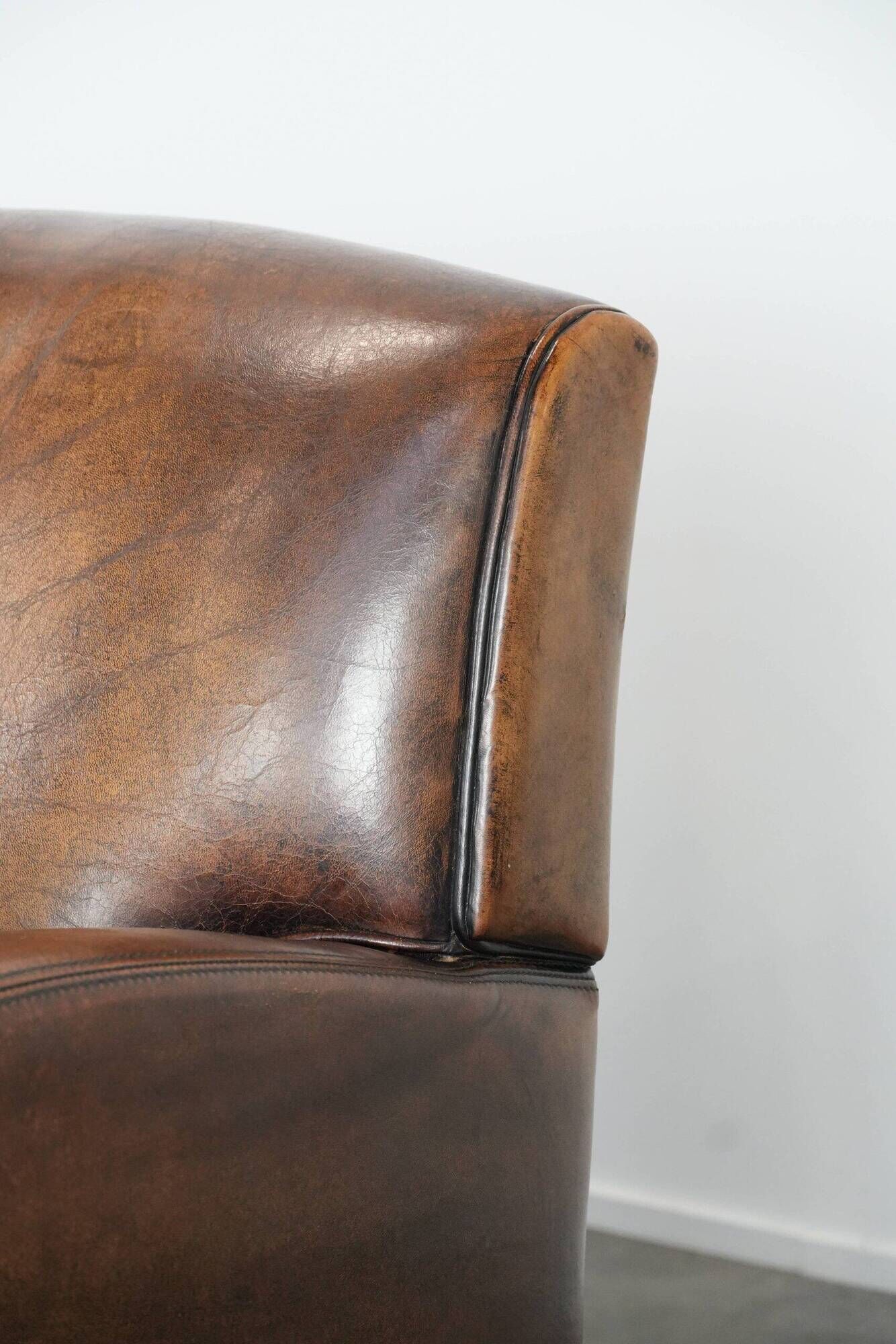 Characterful set of two vintage sheepskin armchairs with beautiful colours