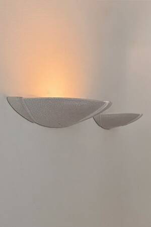 Pair of vintage wall lights in glazed white porcelain, France 1970.