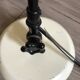 Desk lamp has two articulated metal arms