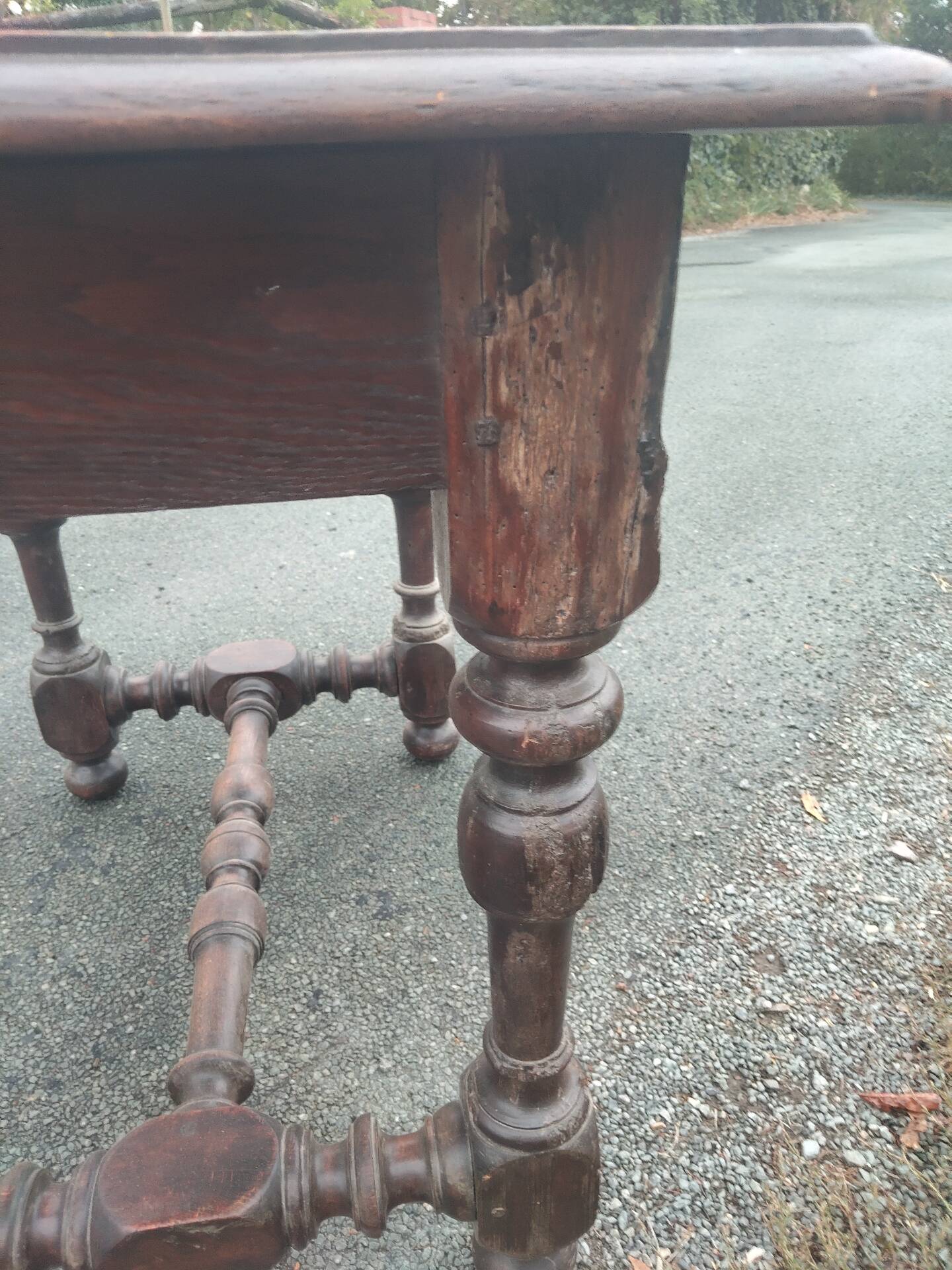 Small antique writing table in Louis XIII style made of oak.