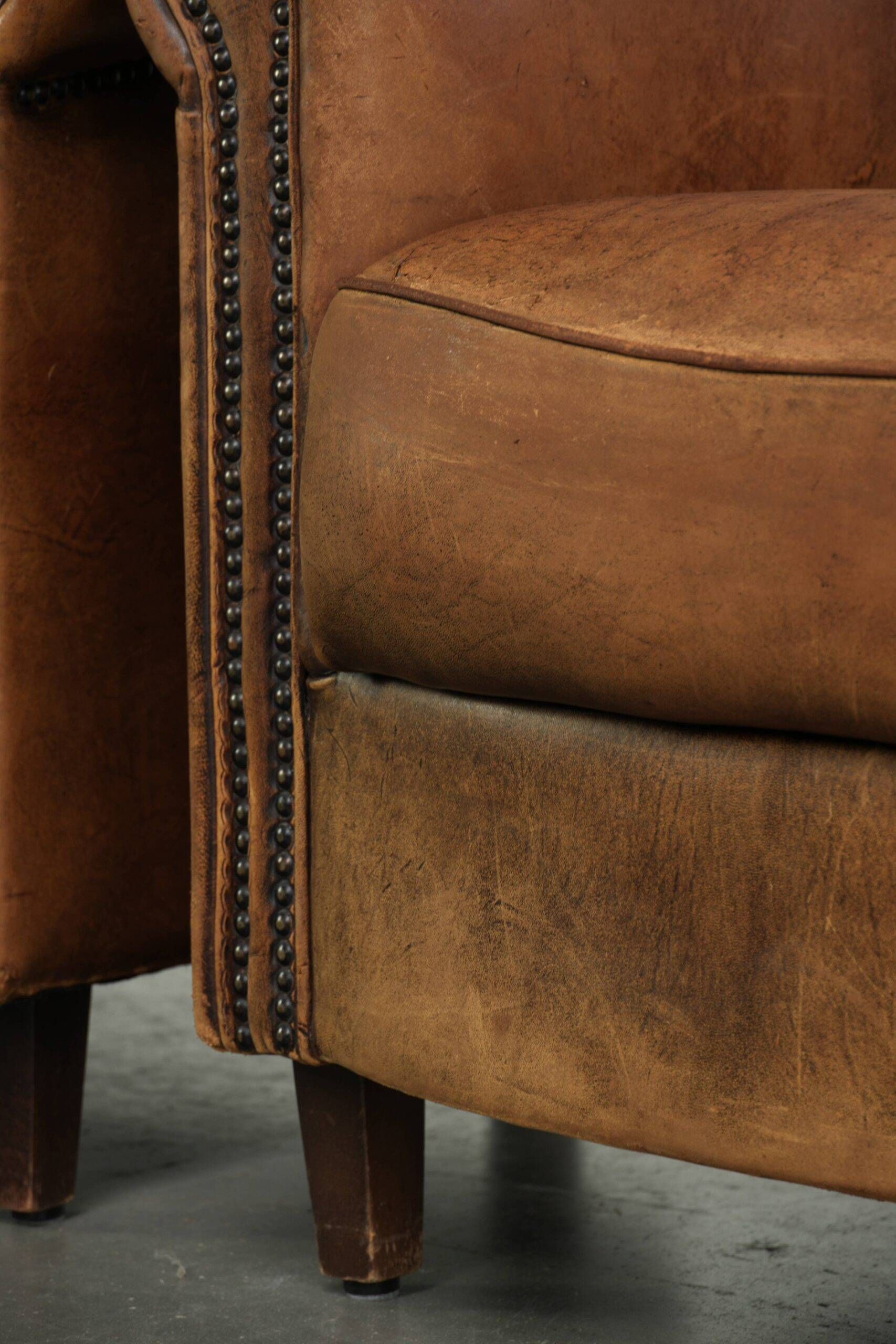 Sturdy set of vintage sheepskin club armchairs with a great appearance