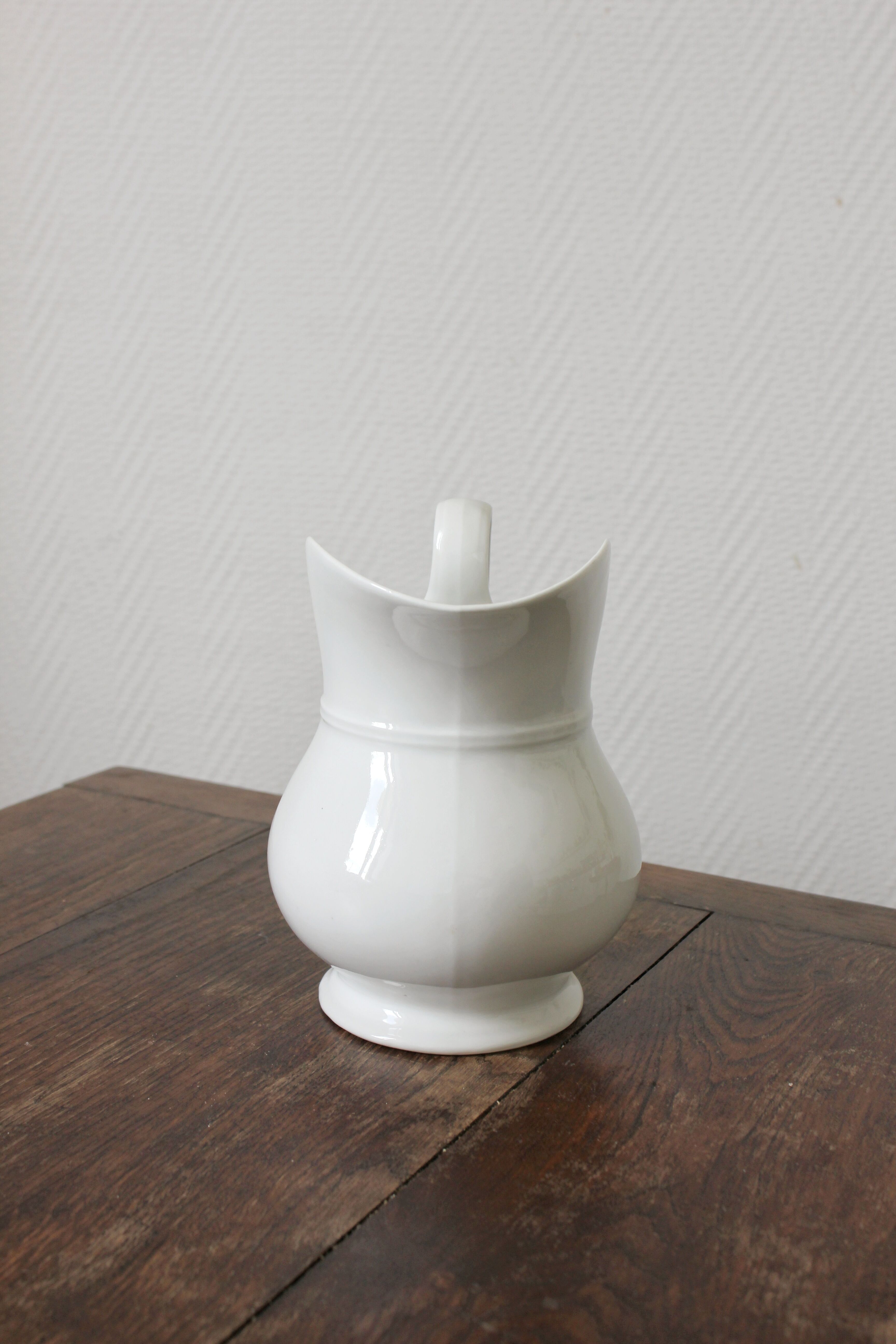 Antique white porcelain jug from the 19th century
