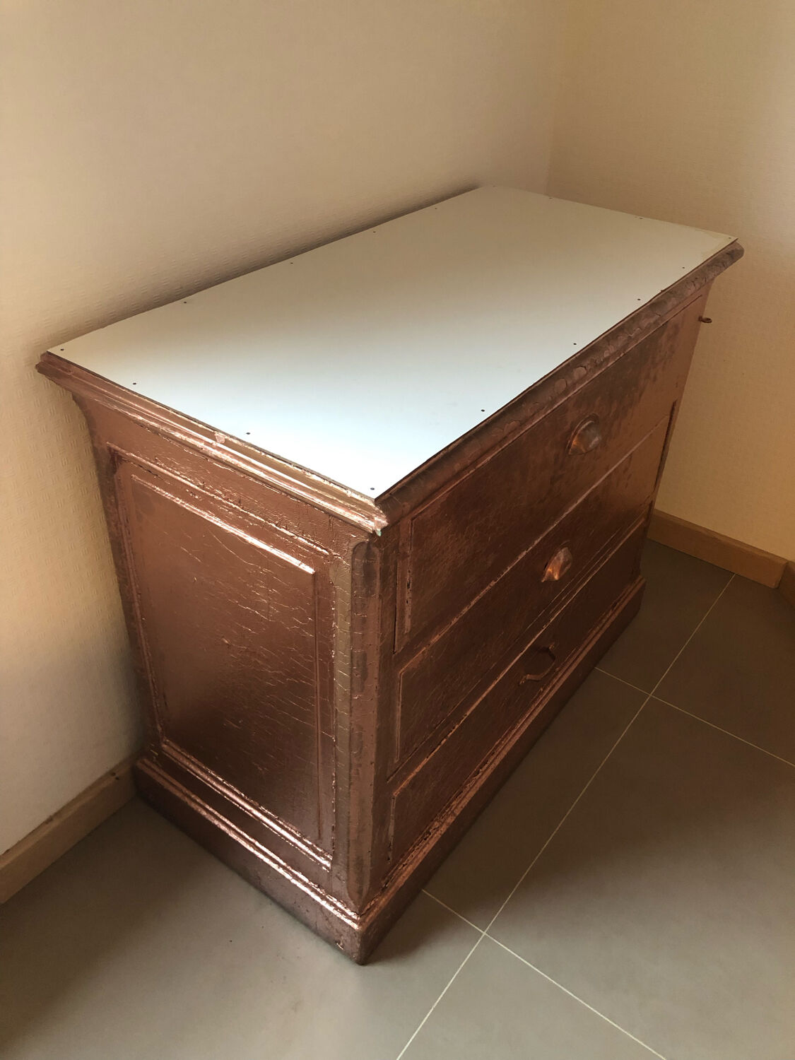 Old chest of drawers restored golden copper color