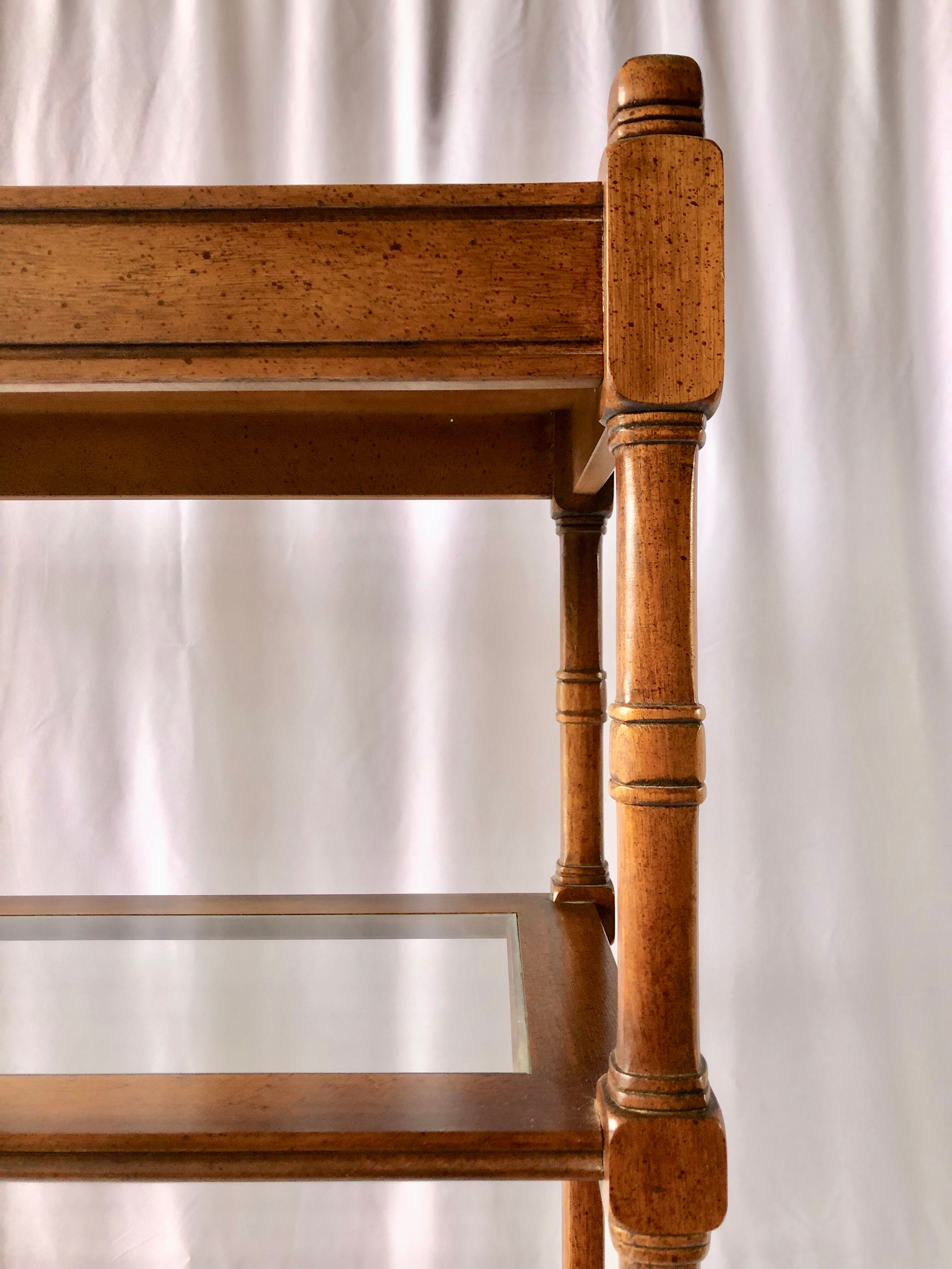 Classic wooden shelves, glass tops and cannage