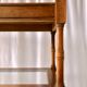 Classic wooden shelves, glass tops and cannage