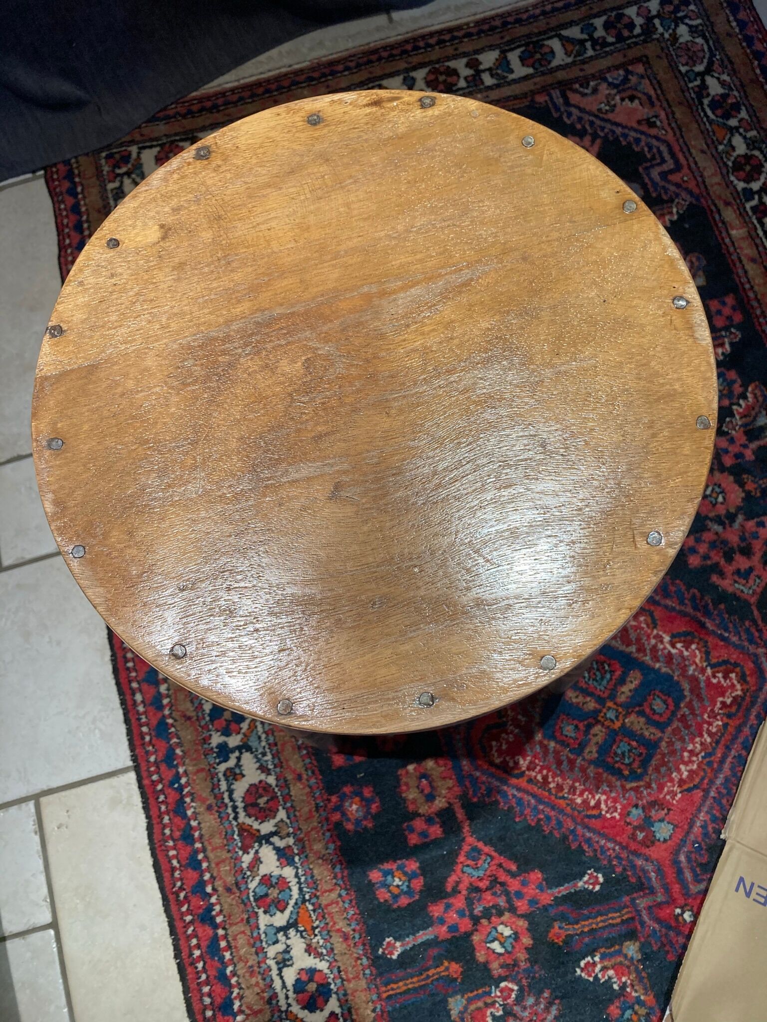 High curved wooden stool