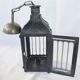 Old chandelier hanging lantern with candle in sheet metal