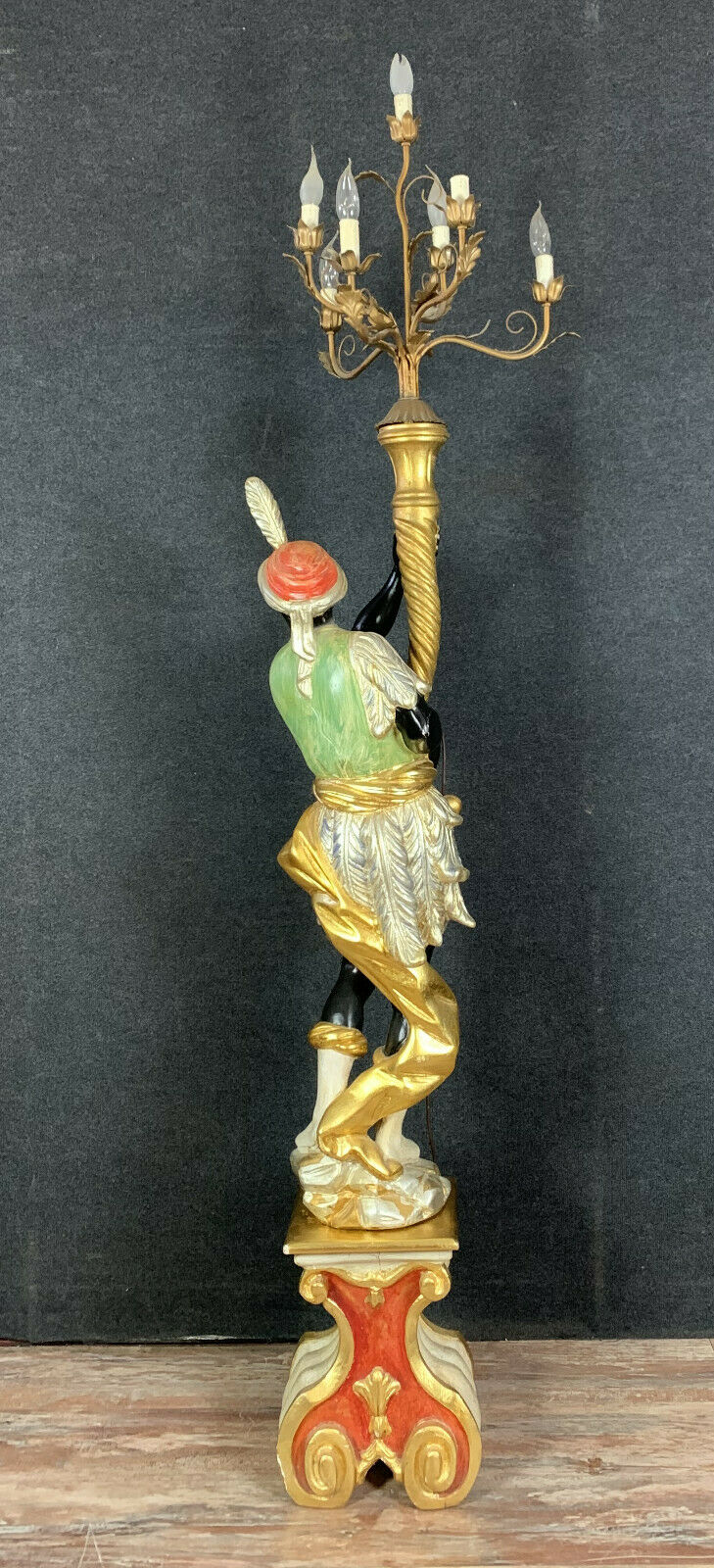 Early XXth era polychrome wooden torch has figuration of a Moor in traditional costume from the 18th