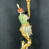 Early XXth era polychrome wooden torch has figuration of a Moor in traditional costume from the 18th