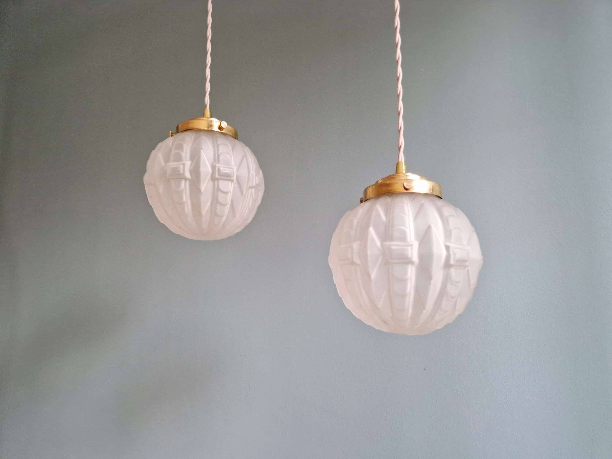 Pair of Art Deco pendant lights in pressed molded satin glass, 1920-30
