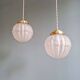 Pair of Art Deco pendant lights in pressed molded satin glass, 1920-30