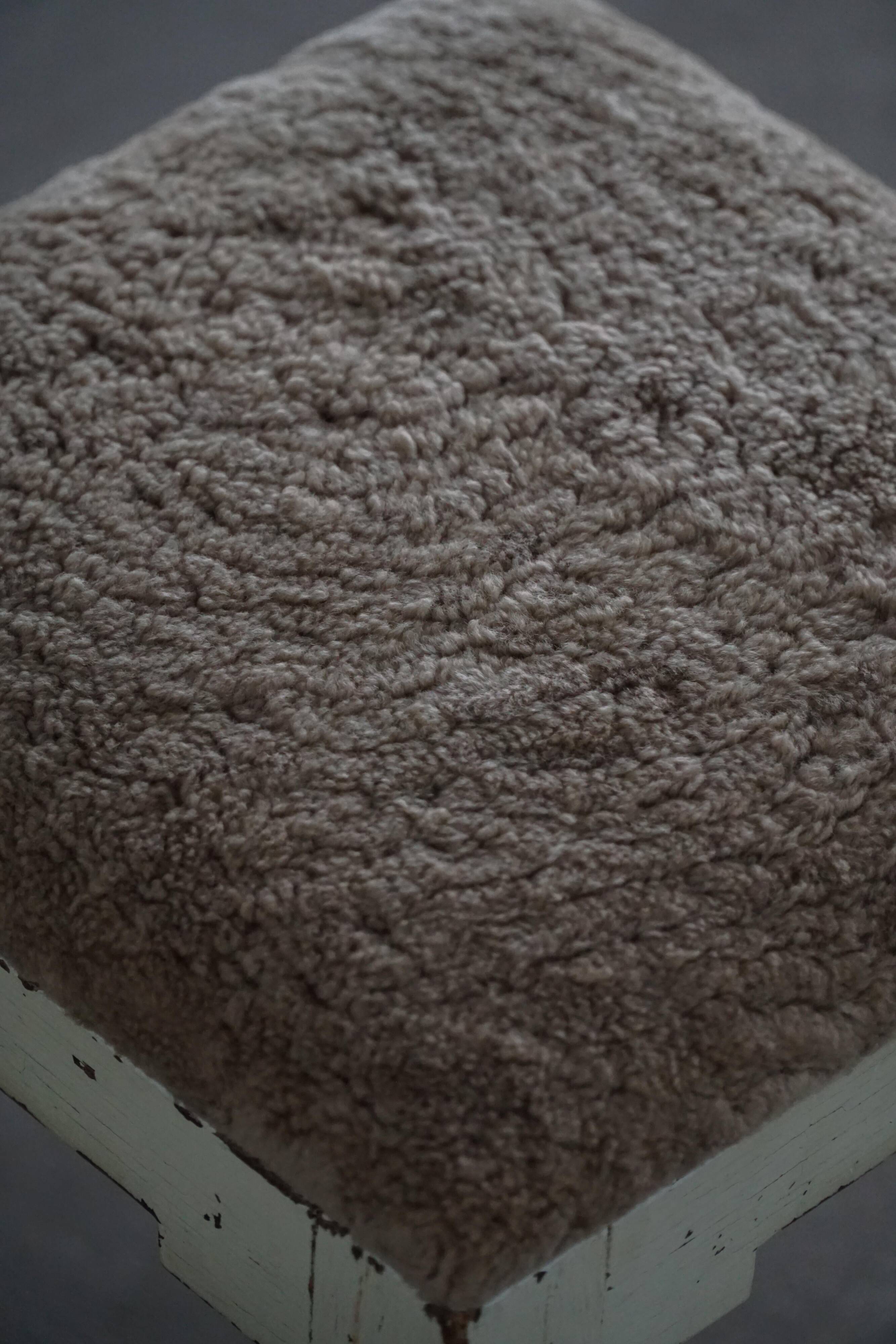 A pair of antique Danish stools, seats in lambswool, late 19th century.