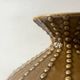 Pyriform vase in glazed ochre ceramic and beads.
