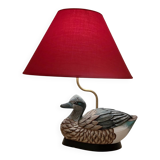 Decorative table lamp with a sculpted duck-shaped base and painted finish.