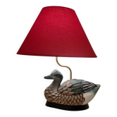 Lampe à poser décorative avec un pied en forme de canard sculpté et pe