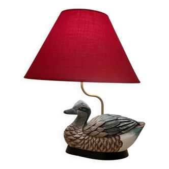 Decorative table lamp with a sculpted duck-shaped base and painted finish.