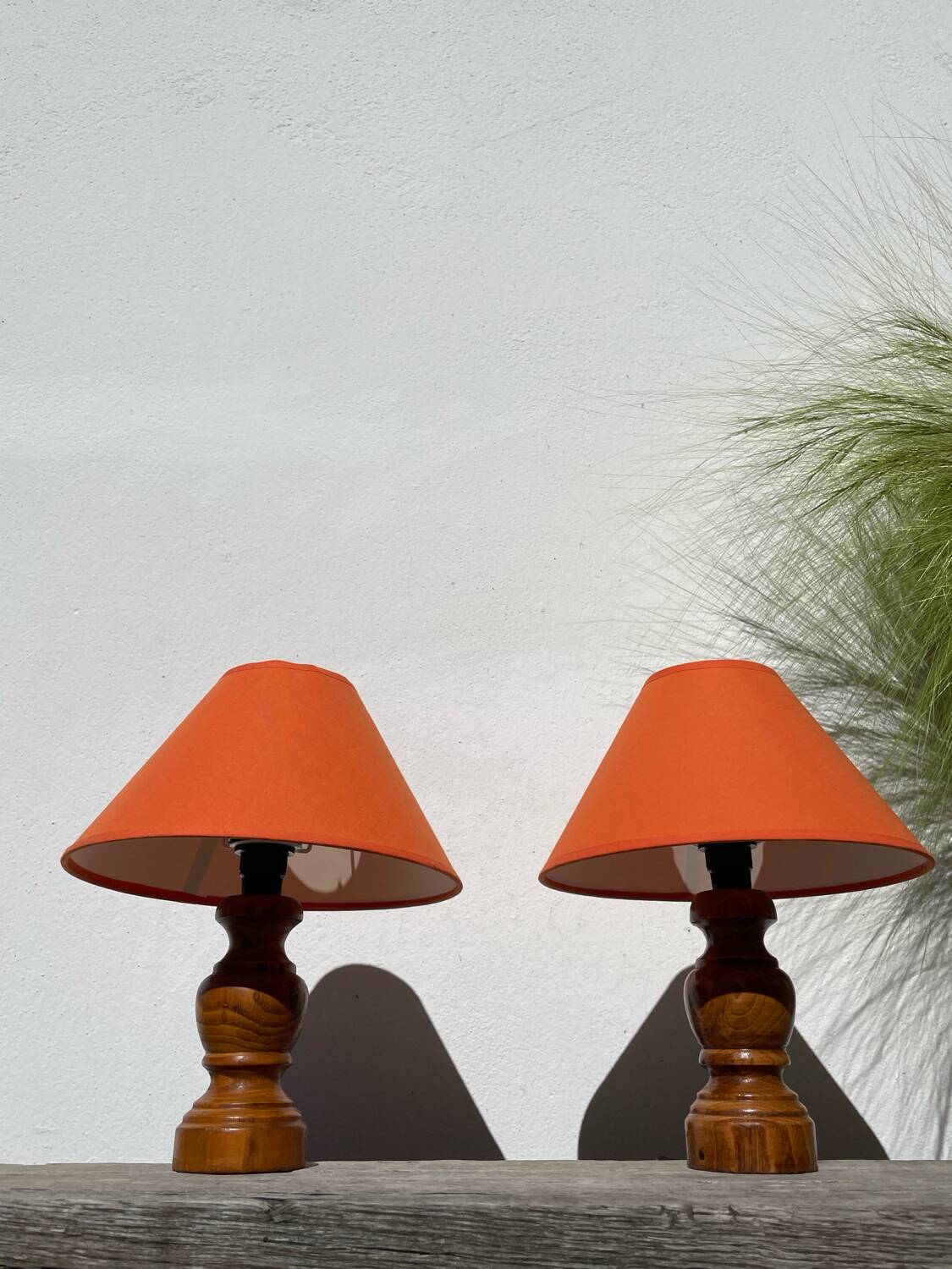 Pair of orange turned wood lamps