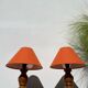 Pair of orange turned wood lamps