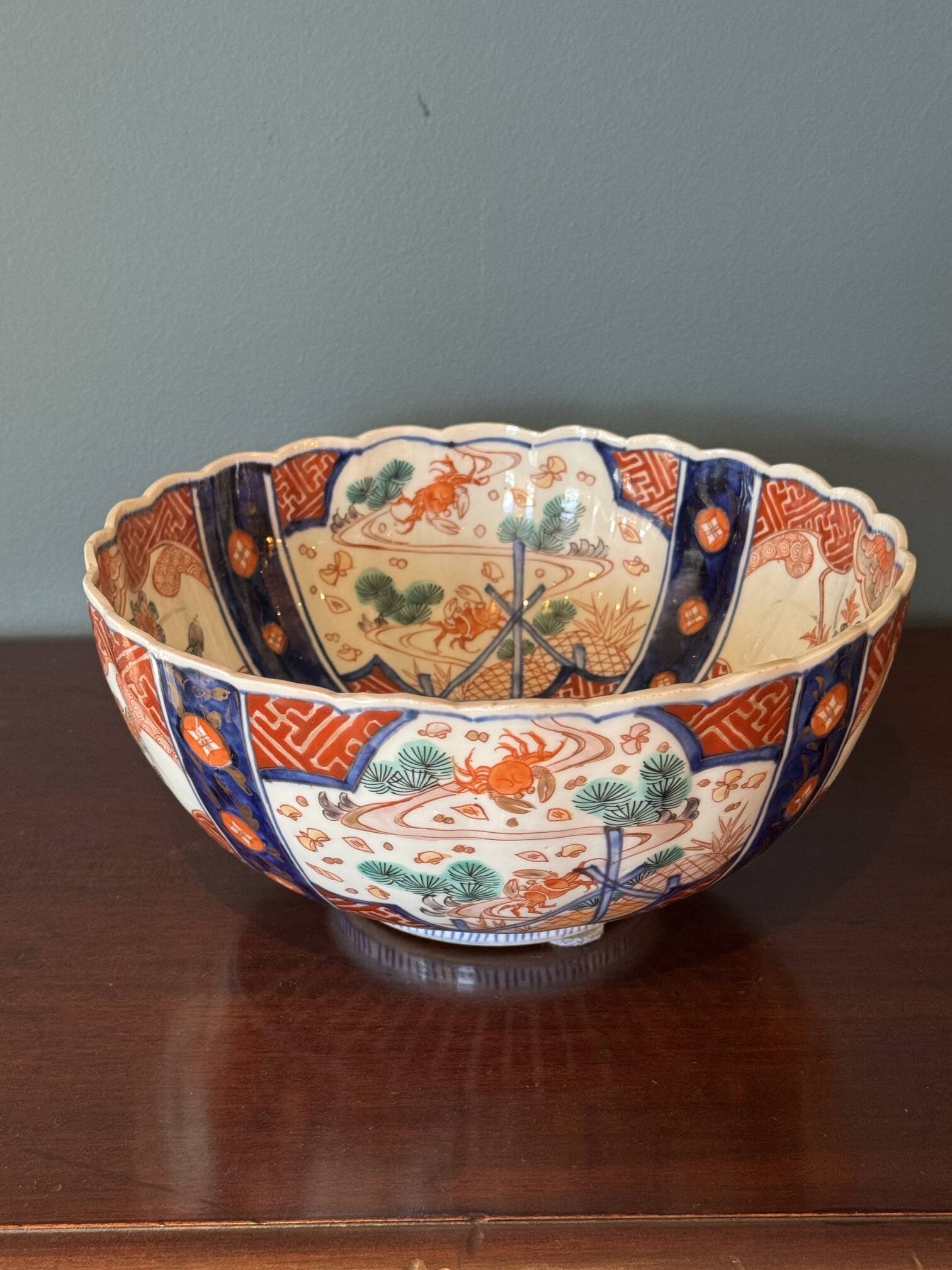 Hand-painted Imari porcelain bowl with an elegant scalloped rim