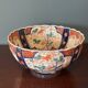 Hand-painted Imari porcelain bowl with an elegant scalloped rim