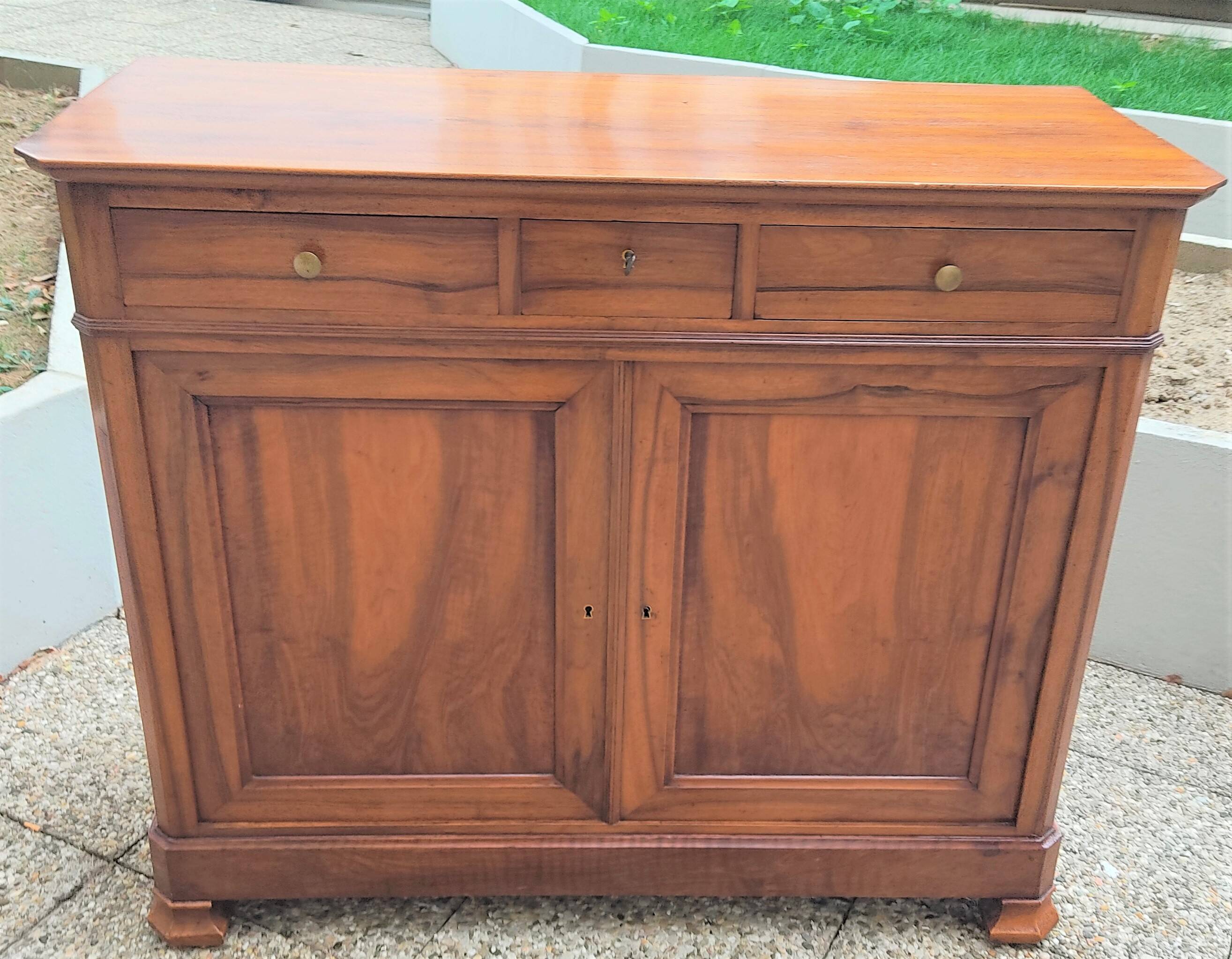 Solid walnut sideboard of the Napoleon III period, late nineteenth century, Louis Philippe style