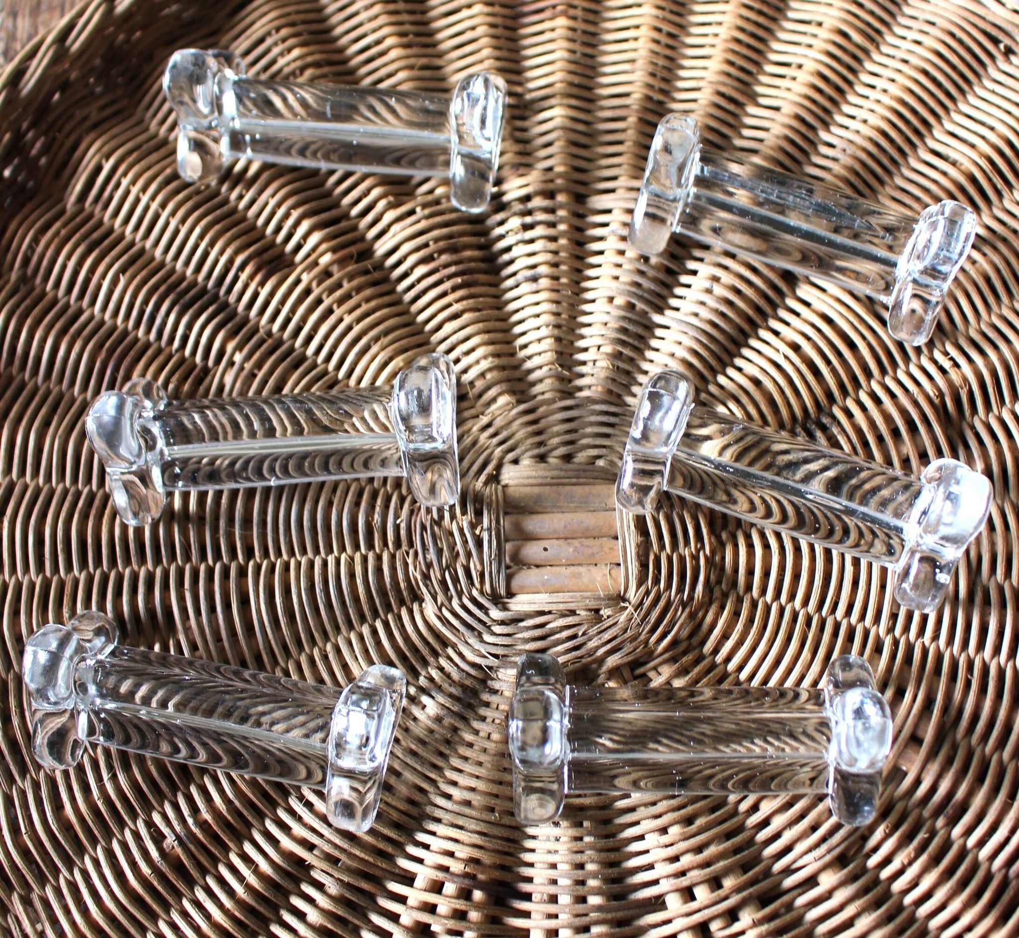 A set of 6 transparent trilobite glass knife rests.