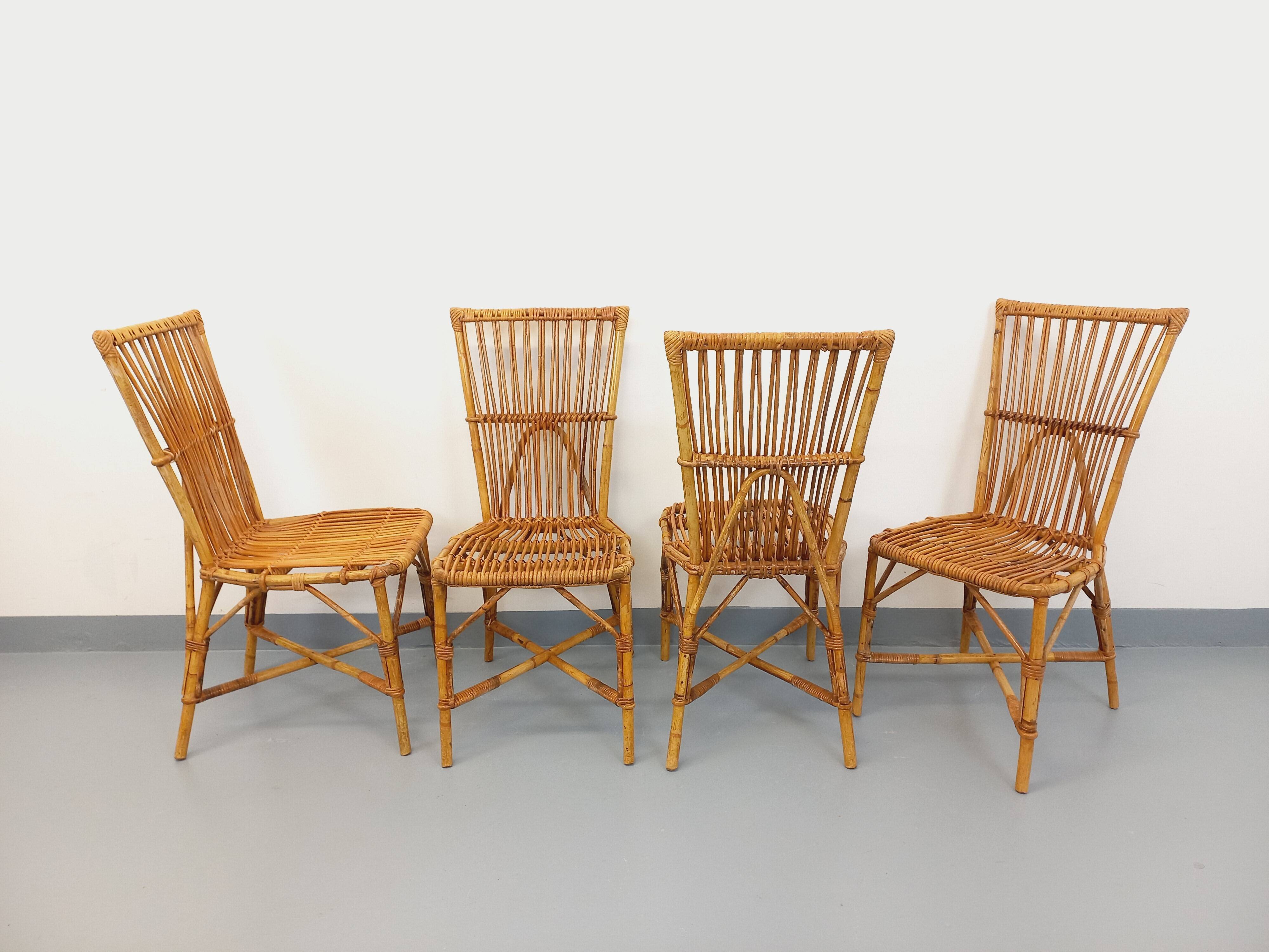 Set of 4 vintage Audoux Minet rattan chairs from the 1950s and 60s.