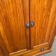Small wardrobe / bonnetière in solid honey pine with 2 doors and 1 drawer.