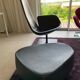 Fjord armchair by Moroso with its pouf, designed by Patricia Urquiola in 2002, made of steel and smooth black leather.
