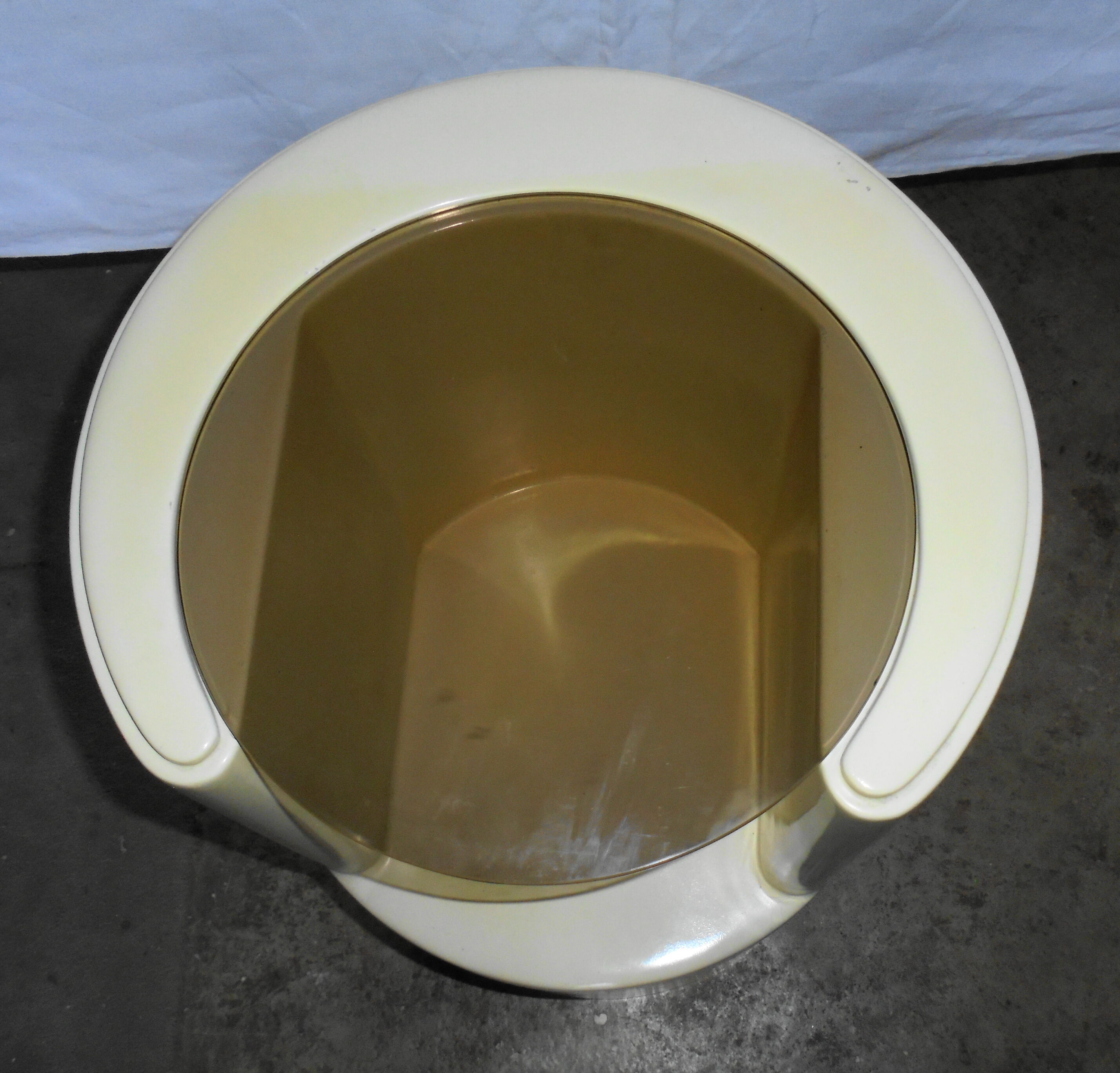 Cylindrical fiberglass bedside table from the 60s