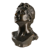 Ancient sculpture of a young woman's face in bronze, 19th-20th century.