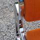Pair of designer armchairs in orange fabrics and chrome tubes from the 70s